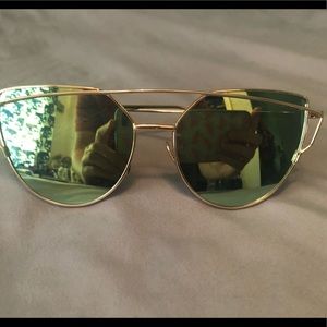 Gold sunglasses with green tint